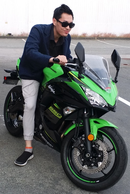 Photo of a man sitting on a motorcycle